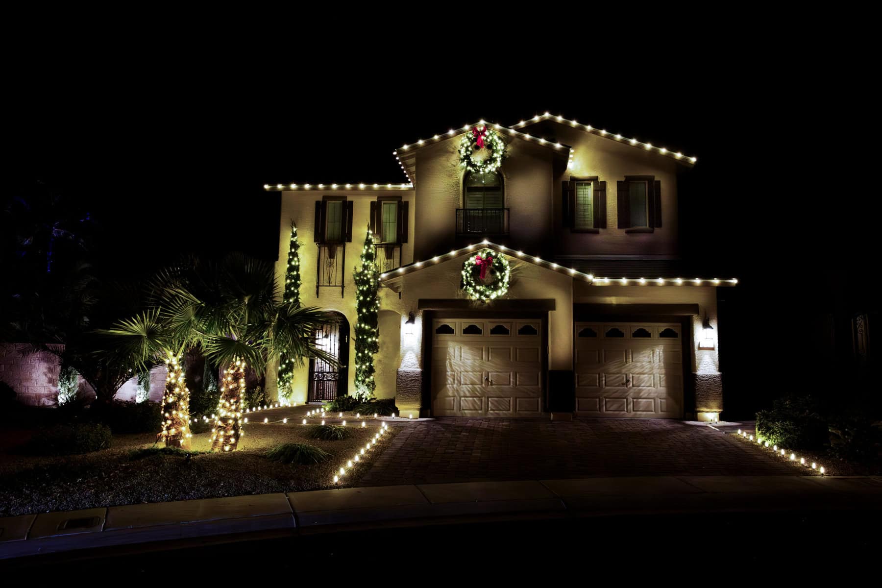 A Phoenix residence with warm white Christmas lights installed