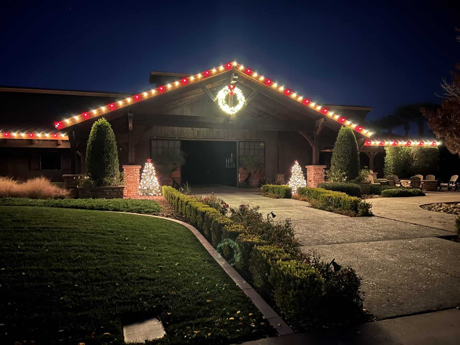 Warm White and Red Candy Cane Christmas Lights installed on the beautiful gabled roof trusses